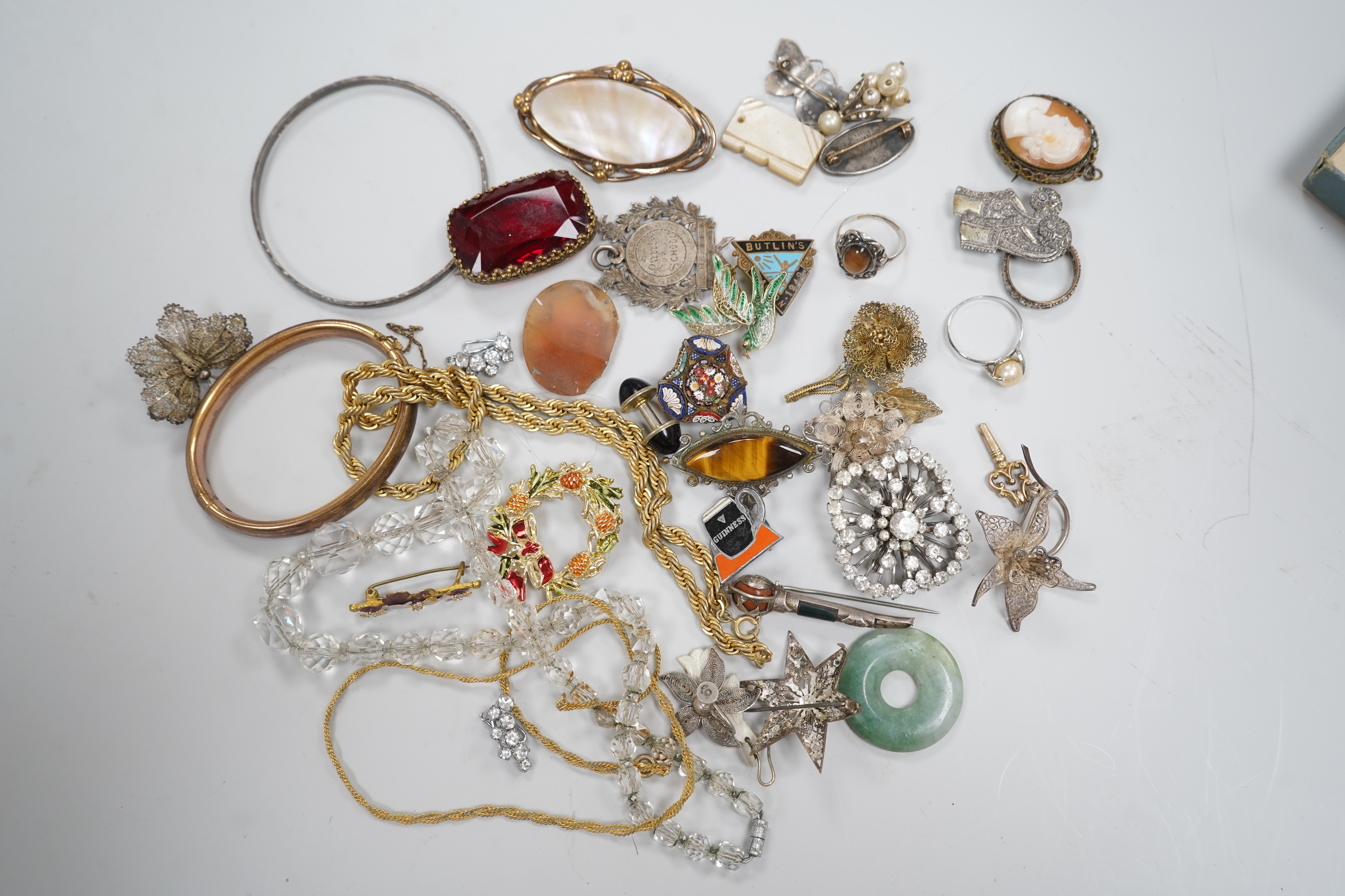 A group of costume jewellery and collector's items in a Japanese lacquer box
